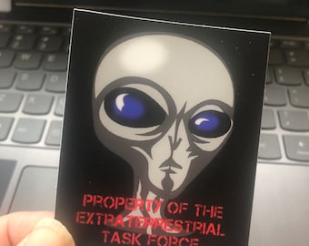 The Property of the Extraterrestrial Task Force Ufo Alien Vinyl Glossy Stickers 2.1x3 in, Laptop surfaces.