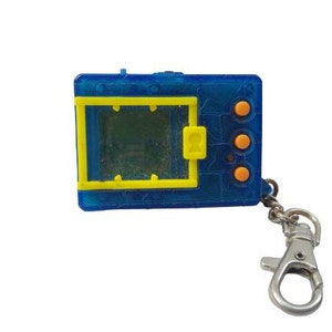 May include: A blue and yellow digital pet keychain with three orange buttons. The screen is blank.
