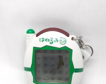 Tamagotchi Plus Keitai Hanerutchi Japonés