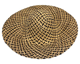 May include: A wide-brimmed straw hat with a black and tan woven pattern. The hat has a rounded crown and a wide, floppy brim.