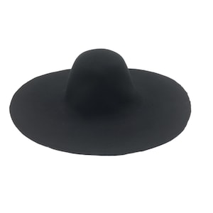 May include: A wide-brimmed black felt hat with a rounded crown.