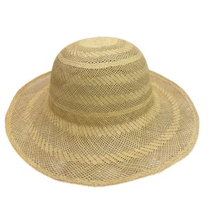 Beige Panama hat body with a wide brim and a rounded crown.