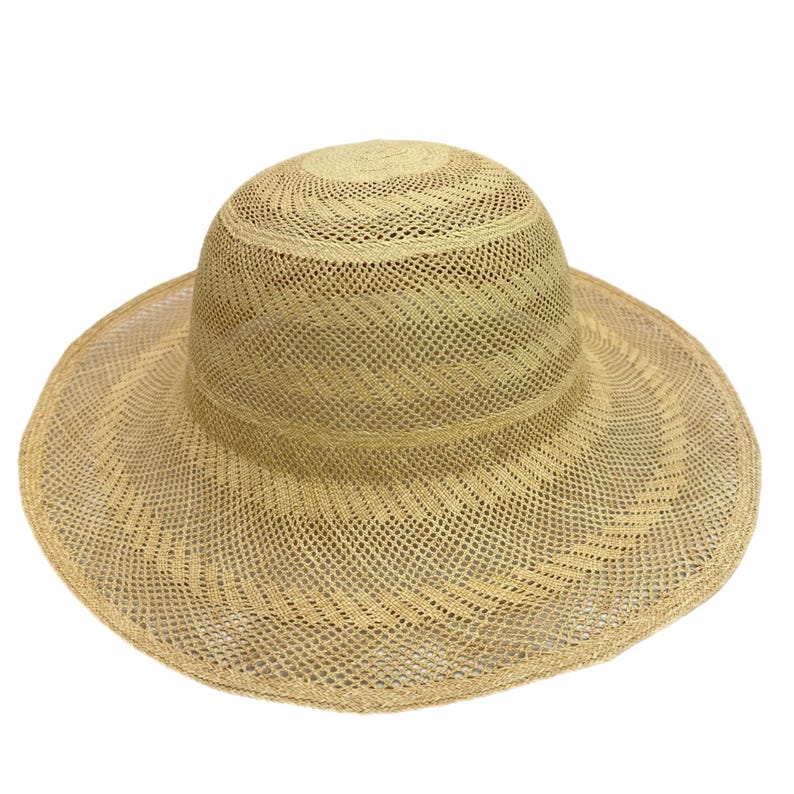 Beige Panama hat body with a wide brim and a rounded crown.