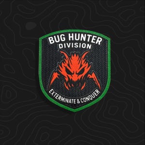 May include: A shield-shaped embroidered patch with a black background and a green border. It features an orange stylized insect graphic in the center, with the white text BUG HUNTER DIVISION above and EXTERMINATE & CONQUER below the graphic.
