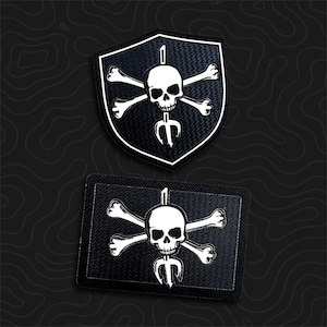 May include: Two embroidered patches featuring a white skull and crossbones design centered over a vertical trident. One patch is shield-shaped, and the other is rectangular. Both patches have a black background with white stitched borders.
