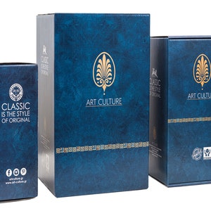 May include: Three blue boxes with gold accents. The largest box has the text "ART CULTURE" on the front. The middle box has the text "CLASSIC IS THE STYLE OF ORIGINAL" on the front. The smallest box has the text "ART CULTURE" on the front.