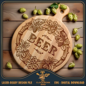 May include: A round wooden cutting board with a laser-etched design of a wreath of hops and vines surrounding the word "BEER". The board has a handle and is surrounded by green hops.
