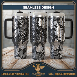 May include: A set of three stainless steel tumblers with a black and white leaf pattern. The tumblers have a handle and a lid. The tumblers are on a wooden surface. Seamless Design.