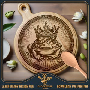 May include: A round wooden cutting board featuring a laser-engraved illustration of a frog wearing an ornate crown, centered within a circular decorative frame. The design includes radiating lines and intricate details, presented as a digital file.