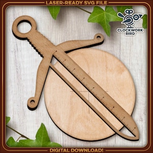 May include: A wooden laser-cut design of a sword with a ruler on the blade and a circle at the end. The design is on a wooden background with green leaves.