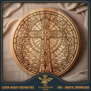 May include: A circular wooden plaque featuring a laser-engraved design of a cross centered within a circular frame. The artwork mimics a stained glass window pattern with intricate floral motifs, radiating lines, and geometric borders.