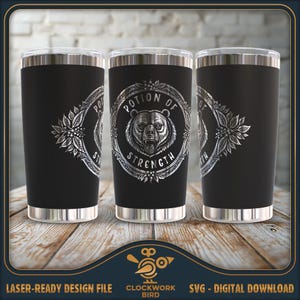 Könnte beinhalten: Drei schwarze Edelstahlbecher mit einem silbernen Design eines Bären und den Worten "Potion of Strength".