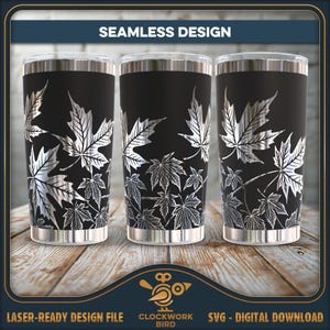 May include: Three cylindrical tumblers featuring a seamless design of metallic silver maple leaves against a matte black background. The text SEAMLESS DESIGN appears at the top, while the bottom displays LASER-READY DESIGN FILE and CLOCKWORK BIRD.