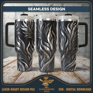 May include: Three black travel mugs with a silver feather design. Each mug has a white lid, a silver rim, and a black handle. The mugs are displayed on a wooden surface. The words "SEAMLESS DESIGN" are at the top.