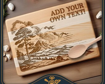 May include: A rectangular wooden cutting board featuring a laser-engraved landscape illustration of a pine tree and mountains. The board includes the text ADD YOUR OWN TEXT! and is accompanied by a light-colored wooden spoon resting on its surface.