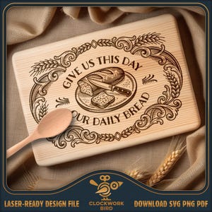 May include: A rectangular light-colored wooden cutting board featuring a laser-engraved design of a loaf of bread, a knife, and wheat stalks. The text reads GIVE US THIS DAY OUR DAILY BREAD. A wooden spoon rests on the left side of the board.