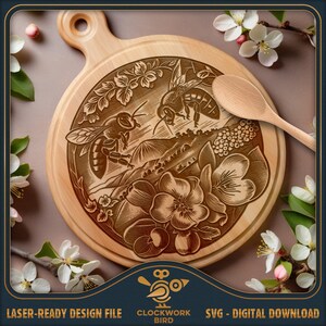 May include: A wooden cutting board with a laser-engraved design of two bees flying over a field of flowers. The design is in a vintage style and features intricate details. The board is round and has a handle.