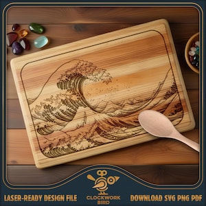May include: A rectangular wooden cutting board featuring a laser-engraved design of a large ocean wave. The board has a light brown wood grain finish and a rounded border. A light-colored wooden spoon rests on the bottom right corner of the board.