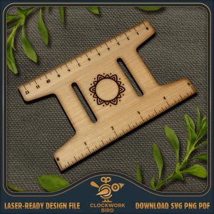 May include: A wooden ruler with a decorative mandala design in the centre. The ruler has markings in inches from 0 to 6 and from 1 to 5. The ruler is a crafting tool for measuring and marking.