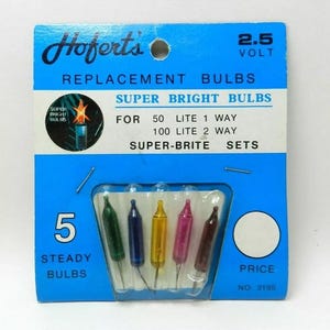 May include: A package of five replacement bulbs in various colors: green, blue, yellow, pink, and brown. The blue and white package reads "Hoferts Replacement Bulbs" and "Super Bright Bulbs". The package also states "5 Steady Bulbs".