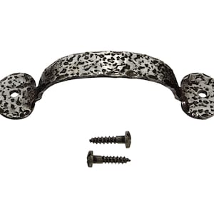 May include: A hammered iron door pull with a heart-shaped design and two screws.