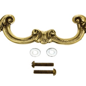 May include: A gold-toned ornate pull handle with a decorative scroll design. The handle comes with two screws and two washers.