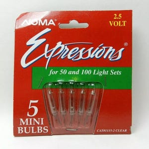 May include: A red and green package of 5 clear mini light bulbs for Christmas lights. The package says "Expressions" for 50 and 100 light sets, 2.5 volt, and CAT#1115-2 CLEAR.