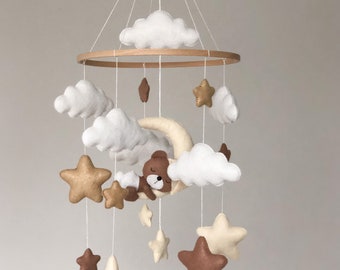 Baby mobile made of felt with a sleeping bear in neutral colors with a moon, stars, and clouds, handmade, gift for birth or baby shower.