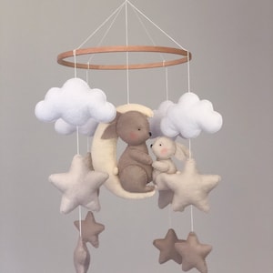 Baby mobile with rabbits on the moon, clouds and stars in beige, handmade from felt, suitable as a gift