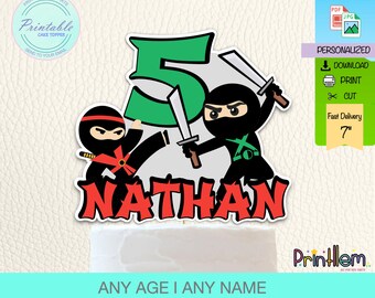 May include: Printable cake topper featuring a green number 5, two ninjas with swords, and the name "NATHAN". The ninjas are wearing black and red outfits. The topper is 7 inches tall.