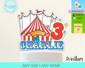 May include: Printable cake topper featuring a red and white striped circus tent with a blue and yellow sign that says "Happy Birthday". The number 3 is in red with yellow outlines and the name "CHARLIE" is in blue with yellow outlines. The topper is 7 inches tall.