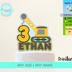 May include: Printable cake topper featuring a yellow construction crane with a blue cab and a grey number 3. The name "ETHAN" is written in grey letters with a green outline. The topper is 7 inches tall.