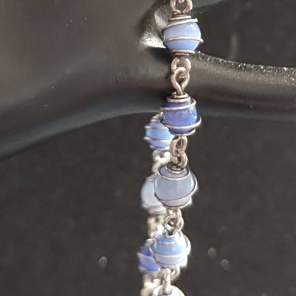 Vintage 7 1/2" Kenneth Cole Blues and Silvertone Bracelet. Delicate Fiber Optic/Cat's Eye Glass Beads Wrapped in Small Cages.