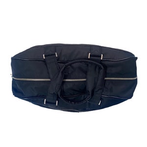 May include: A black nylon duffel bag with silver zippers and a top handle.