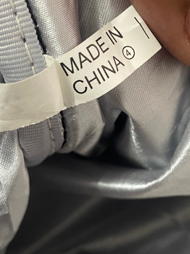 May include: A white label with black text that reads "Made in China" with a circled number 4.