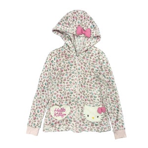 May include: A white, pink and blue leopard print fleece zip-up hoodie with a pink bow on the hood and Hello Kitty patches on the front.