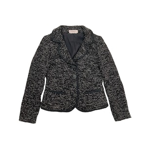 May include: Black tweed blazer with a notched collar, three buttons, and two pockets. The blazer has a black trim around the collar, pockets, and cuffs.