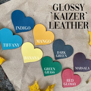 May include: Glossy 'Kaizer' leather swatches in heart shapes in the colors: Indigo, Tiffany, Mango, Banana, Dark Green, Green Grass, Marsala, and Red Glossy.