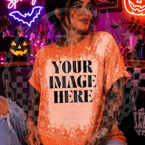 May include: An orange short-sleeved t-shirt with a bleached, distressed effect across the center. The shirt features the black text 'YOUR IMAGE HERE' printed in a bold, sans-serif font. The garment has a crew neckline and rolled sleeves.