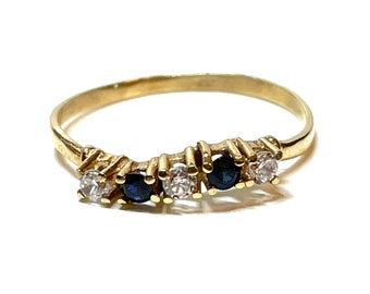 14 carat gold ring with blue sapphire and zirconia