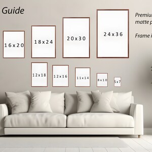 May include: A size guide for art prints, showing different sizes of framed prints on a wall. The sizes are listed in inches, with the largest size being 24x36 inches. The text "Premium fine art matte paper" and "Frame is not included" is also visible.