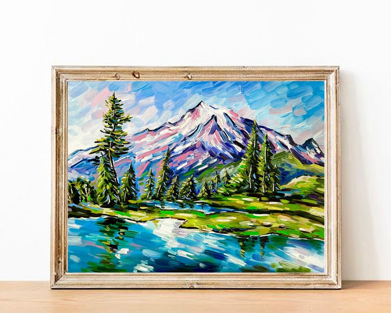 May include: Oil painting of a mountain landscape with a snow-capped peak, green trees, and a blue lake. The artwork is framed in a gold-colored wooden frame. The painting uses thick brushstrokes and vibrant colors.