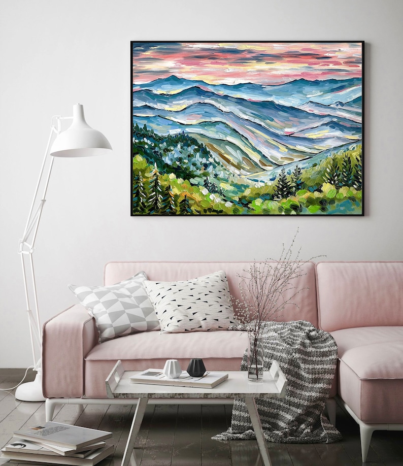 May include: A painting of a mountain landscape with a blue and green color scheme. The painting depicts a series of rolling hills with a forest in the foreground and a hazy sky in the background.
