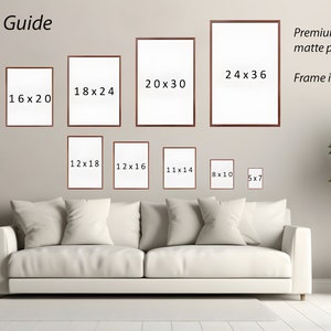 May include: A size guide for art prints, showing different sizes of framed prints on a wall. The sizes are listed in inches, with the largest size being 24x36 inches. The text "Premium fine art matte paper" and "Frame is not included" is also visible.