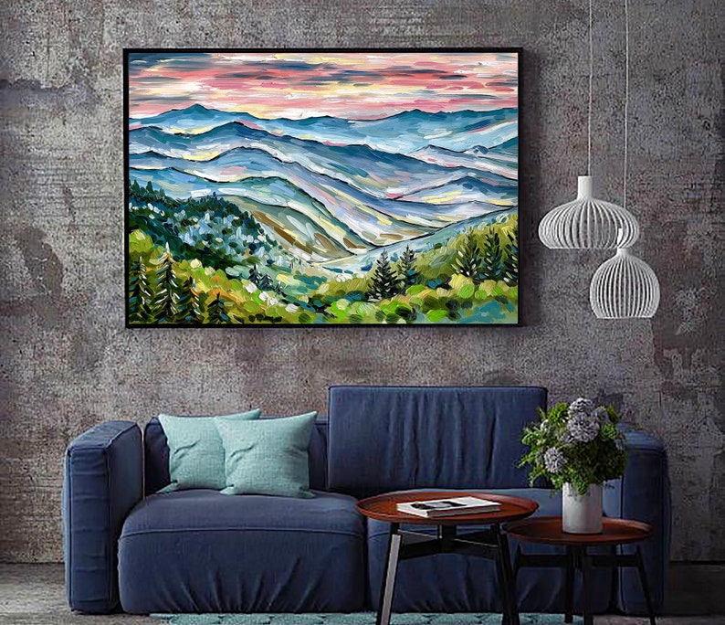 May include: A painting of a mountain landscape with a blue, green, and brown color scheme. The mountains are layered and appear to be in the distance. The sky is a light pink and orange color.