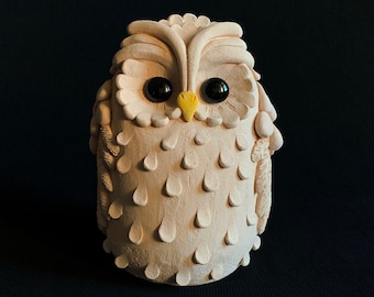 A ceramic owl in white minimalist style, a natural clay bird figure for your home decor or as a gift