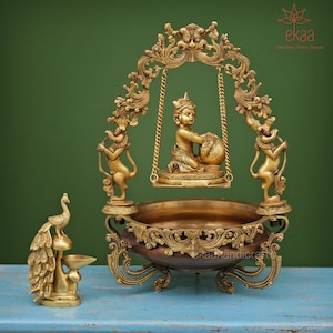 Urli Brass with Laddu Gopal, 53CM Makhan Chor Krishna on Swing, Traditional Home Decor, Indian Uruli Bowl Religious Decor Free Peacock Diya
