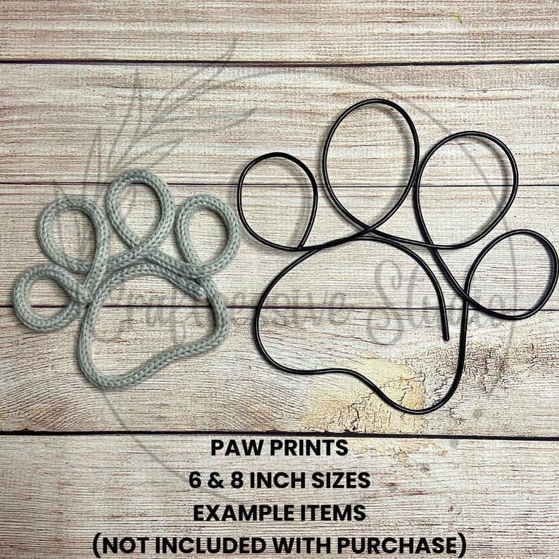 May include: Two paw print shapes, one made of gray yarn and the other made of black wire. The yarn paw print is 6 inches and the wire paw print is 8 inches. The text "PAW PRINTS 6 & 8 INCH SIZES EXAMPLE ITEMS (NOT INCLUDED WITH PURCHASE)" is below the paw prints.