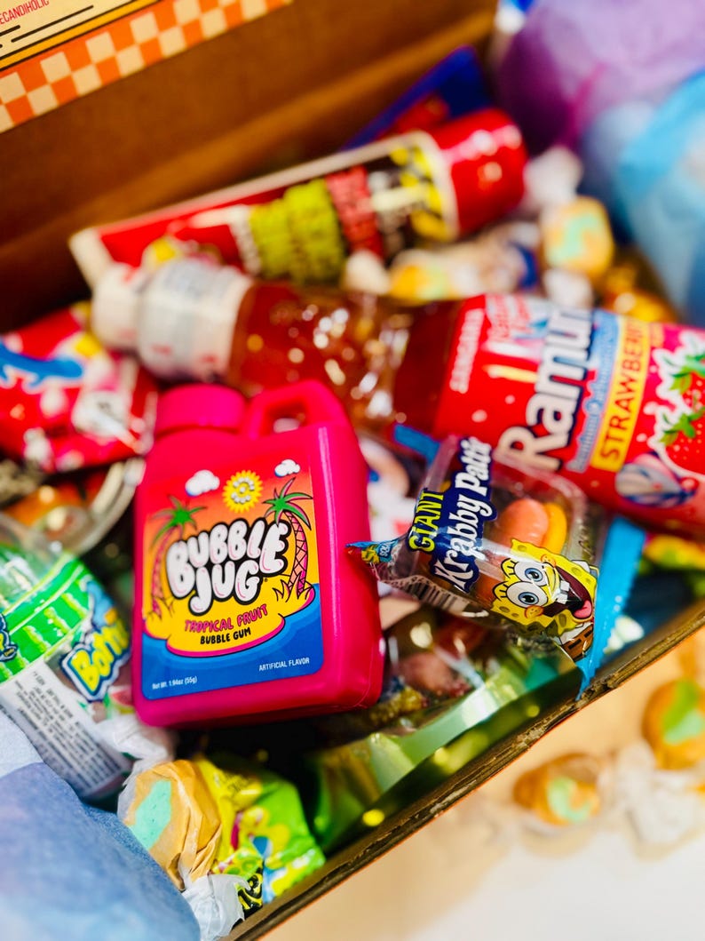 close up of retro candy snacks and gummies and snacks. retro sours, slime lickers, SpongeBob krabby patty, baby bottle bop,