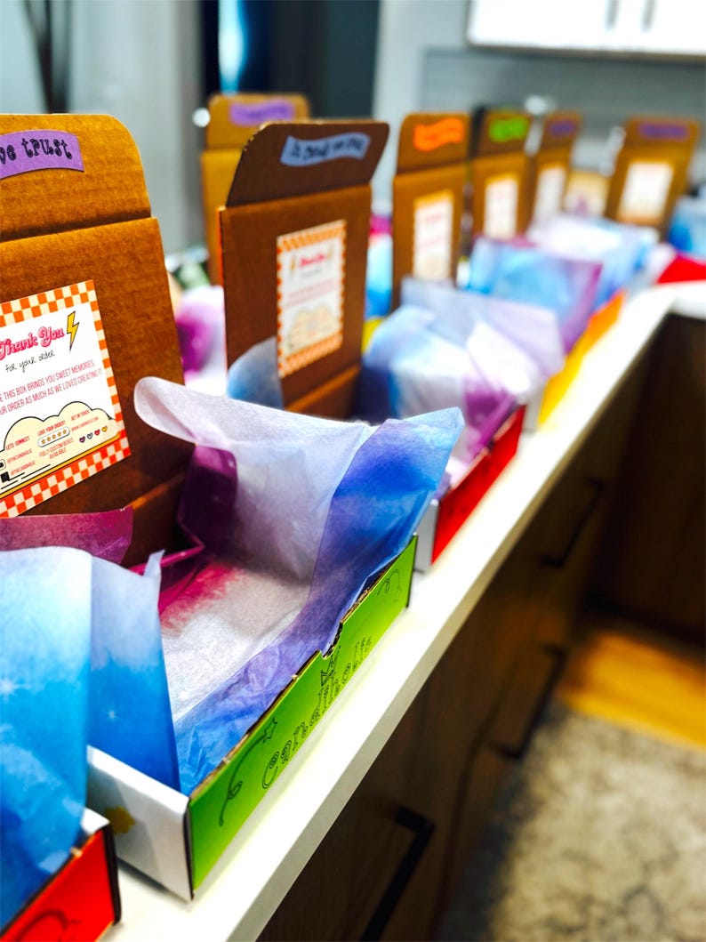custom box assembly line prep work for candy boxes care care package